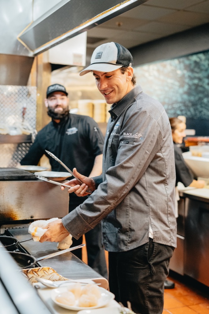 A Fathoms chef working in the kitchen